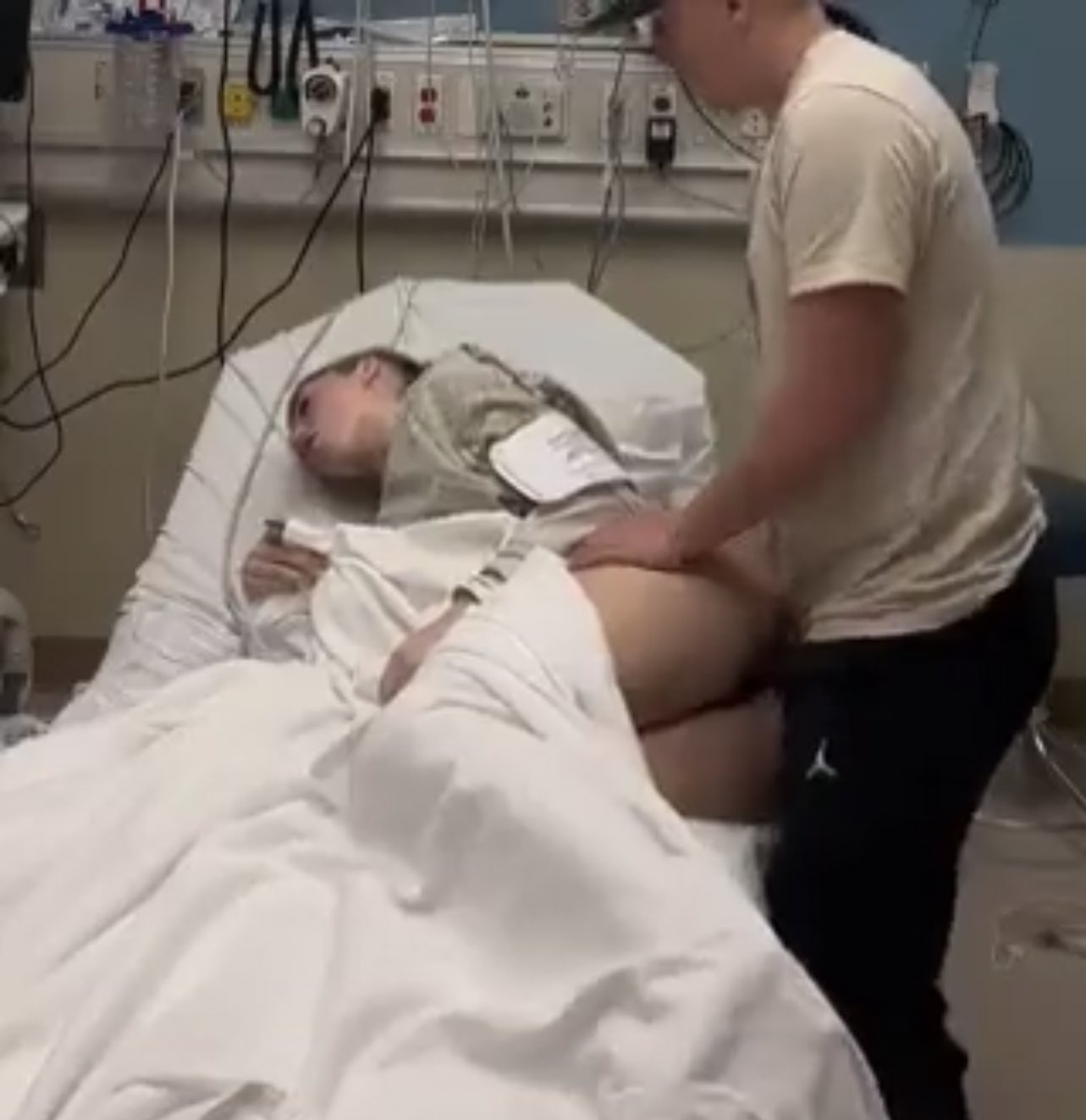 Photo of man having sex with sick woman in hospital bed goes viral