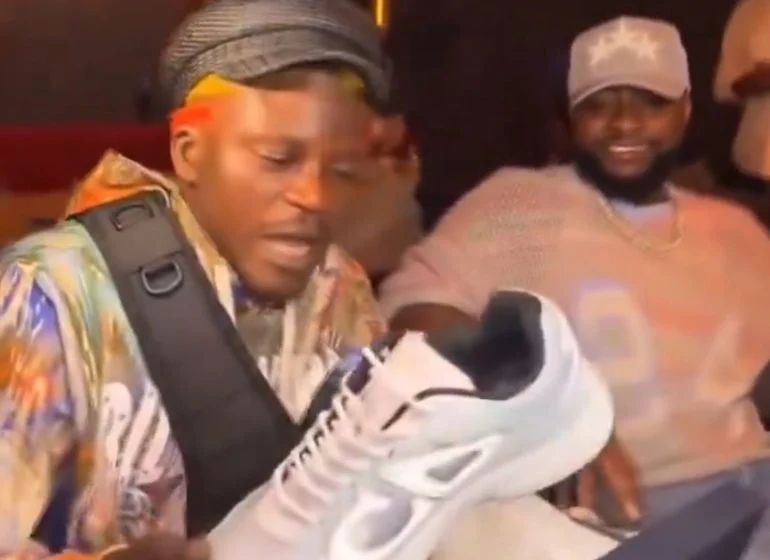 Davido Enjoys Life With Portables In US, Gifts Him Shoe
